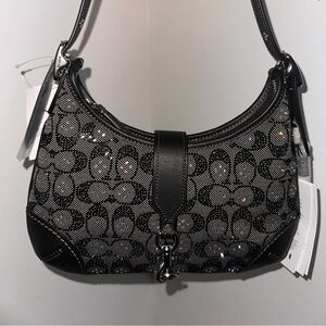 Coach Hampton Hobo Bag
In Crystal Signature Jacquard